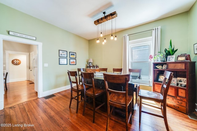 1021 Mulberry St, Louisville, KY 40217 - dining space with hardwood / wood-style floors and a bar