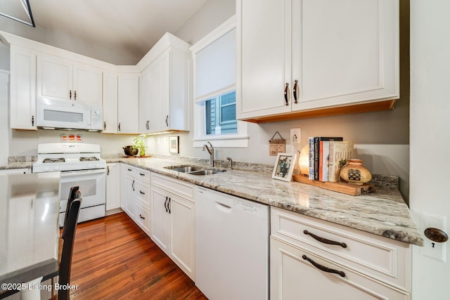 1021 Mulberry St, Louisville, KY 40217 - kitchen featuring white appliances, white cabinetry, dark wood-type flooring, and light stone counters