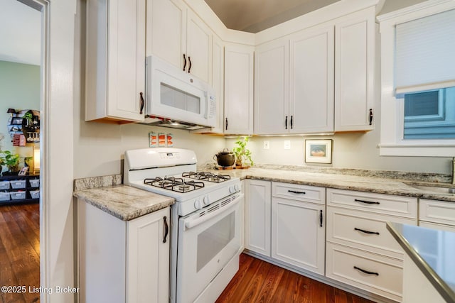 1021 Mulberry St, Louisville, KY 40217 - kitchen with white appliances, dark wood finished floors, white cabinets, and light stone counters