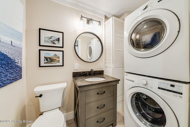 1021 Mulberry St, Louisville, KY 40217 - bathroom with stacked washer / dryer and vanity