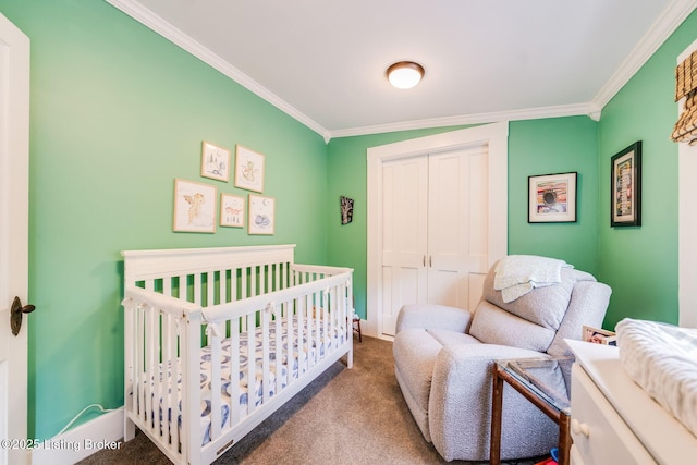 1021 Mulberry St, Louisville, KY 40217 - bedroom featuring ornamental molding, carpet, a closet, and a nursery area