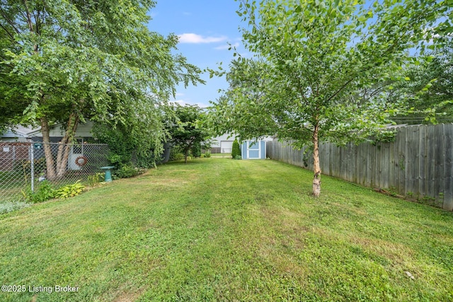 1021 Mulberry St, Louisville, KY 40217 - fenced backyard featuring a storage unit