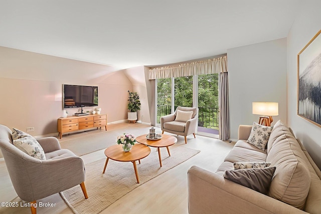 521 Zorn Ave Apt G8, Louisville, KY 40206 - living area featuring light wood-style floors and lofted ceiling