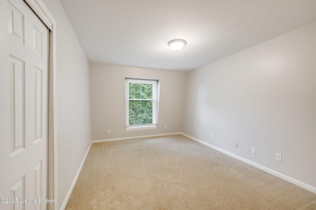 521 Zorn Ave Apt G8, Louisville, KY 40206 - unfurnished room with baseboards and light carpet