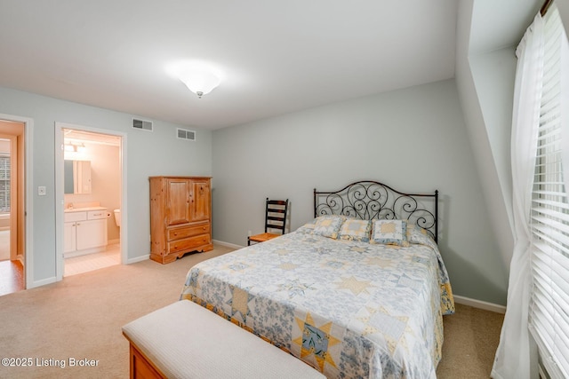 521 Zorn Ave Apt G8, Louisville, KY 40206 - bedroom featuring light colored carpet and connected bathroom