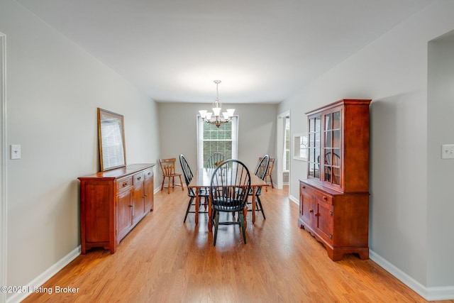 521 Zorn Ave Apt G8, Louisville, KY 40206 - dining space featuring light wood-style flooring and a chandelier