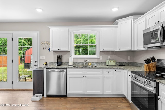 112 Shallow Springs Ct, Bardstown, KY 40004 - kitchen with stainless steel appliances, white cabinetry, recessed lighting, light stone countertops, and wood finished floors