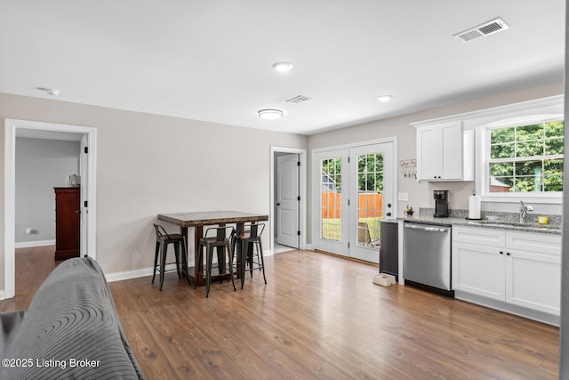 112 Shallow Springs Ct, Bardstown, KY 40004 - kitchen with dishwasher, healthy amount of natural light, wood finished floors, white cabinetry, and recessed lighting
