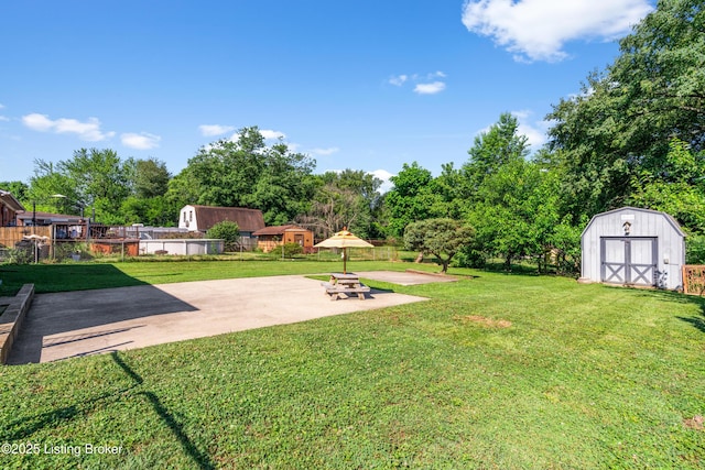 166 Glenview Rd, Shepherdsville, KY 40229 - view of yard with a shed, a patio area, and view of wooded area