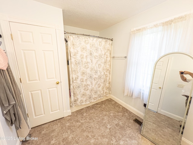 173 Megan Way, Falls Of Rough, KY 40119 - bathroom featuring a textured ceiling and a shower with curtain