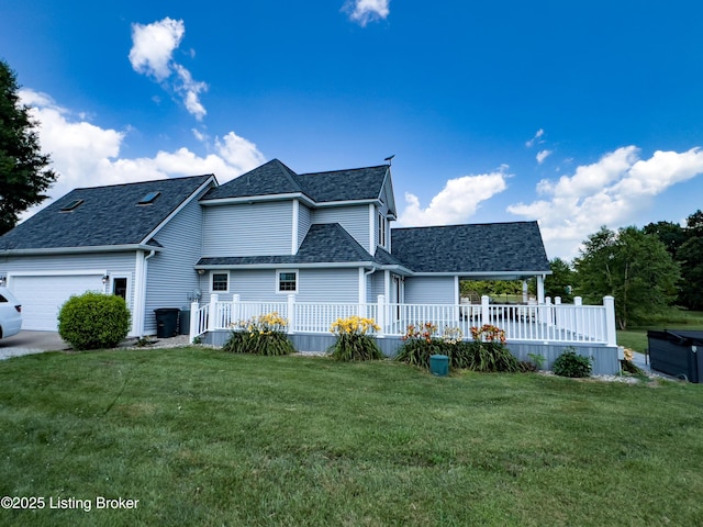 173 Megan Way, Falls Of Rough, KY 40119 - traditional-style home featuring an attached garage, a front lawn, a shingled roof, and a deck