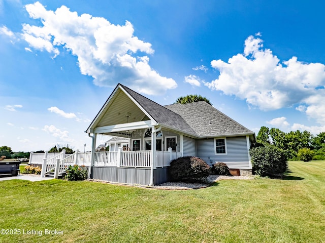 173 Megan Way, Falls Of Rough, KY 40119 - rear view of house with a lawn, a porch, and roof with shingles