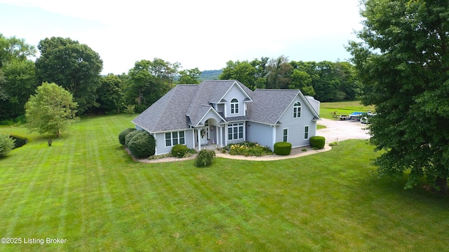173 Megan Way, Falls Of Rough, KY 40119 - traditional-style home featuring a front yard, covered porch, a shingled roof, and driveway