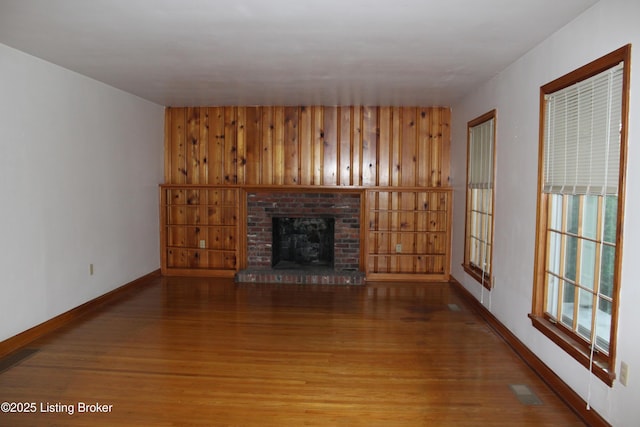 1600 Normandy Rd, Taylorsville, KY 40071 - unfurnished living room with wood finished floors and a brick fireplace