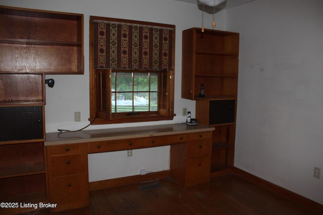 1600 Normandy Rd, Taylorsville, KY 40071 - kitchen featuring built in study area, dark wood-type flooring, open shelves, and light countertops