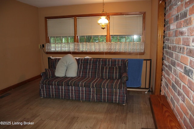 1600 Normandy Rd, Taylorsville, KY 40071 - living room featuring wood finished floors and brick wall