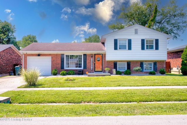 9602 Willowwood Way, Louisville, KY 40299 - split level home featuring an attached garage, brick siding, a front yard, and concrete driveway
