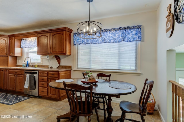 9602 Willowwood Way, Louisville, KY 40299 - kitchen featuring dishwasher, brown cabinetry, a chandelier, and pendant lighting