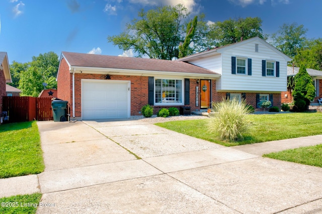 9602 Willowwood Way, Louisville, KY 40299 - tri-level home featuring an attached garage, concrete driveway, and brick siding