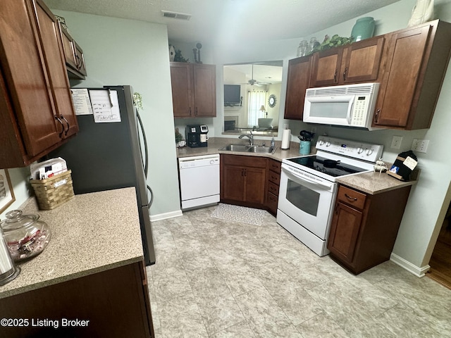 7520 Autumn Pointe Dr, Louisville, KY 40214 - kitchen featuring white appliances, light countertops, and a ceiling fan