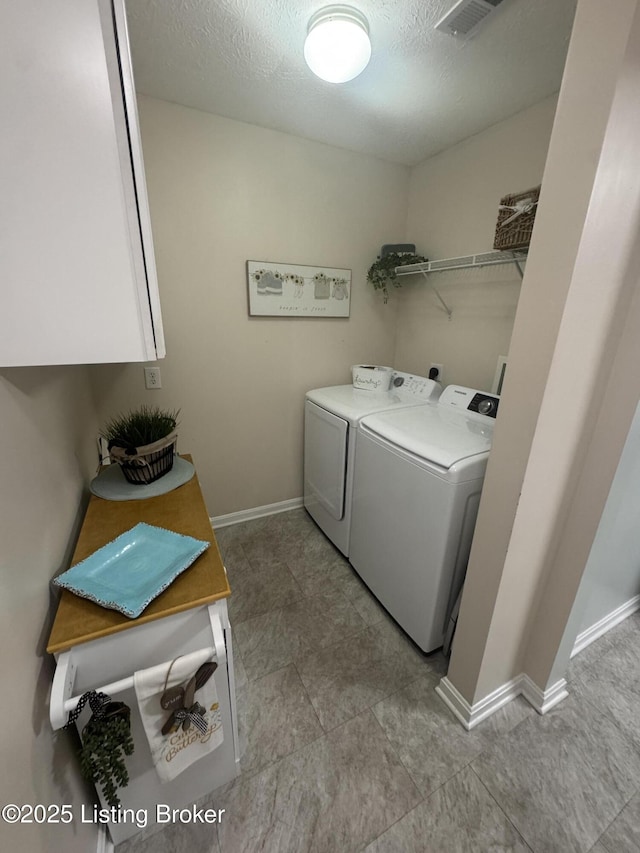 7520 Autumn Pointe Dr, Louisville, KY 40214 - washroom featuring washer and dryer, a textured ceiling, and cabinet space