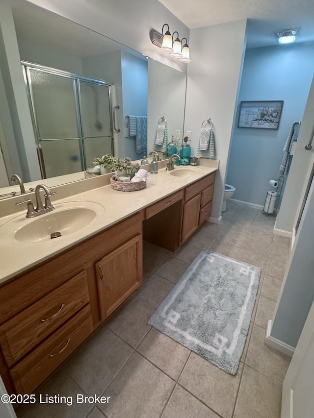7520 Autumn Pointe Dr, Louisville, KY 40214 - bathroom featuring double vanity, tile patterned floors, and a shower stall