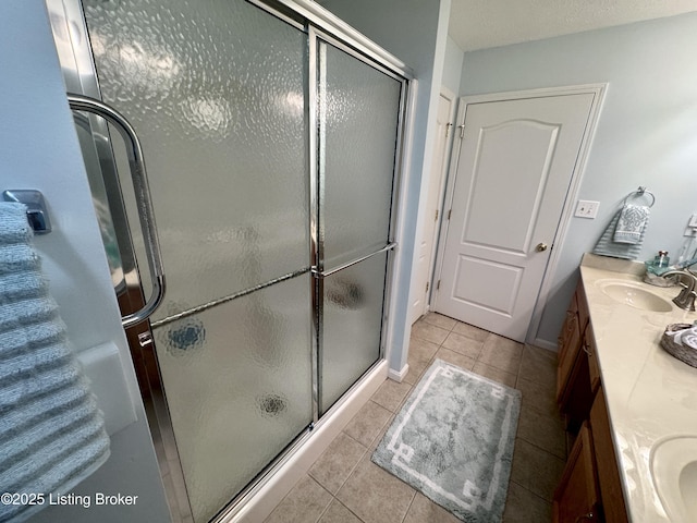7520 Autumn Pointe Dr, Louisville, KY 40214 - full bathroom with double vanity, tile patterned flooring, and a shower stall