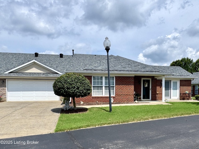 7520 Autumn Pointe Dr, Louisville, KY 40214 - view of front of property with concrete driveway, brick siding, roof with shingles, a garage, and a front yard