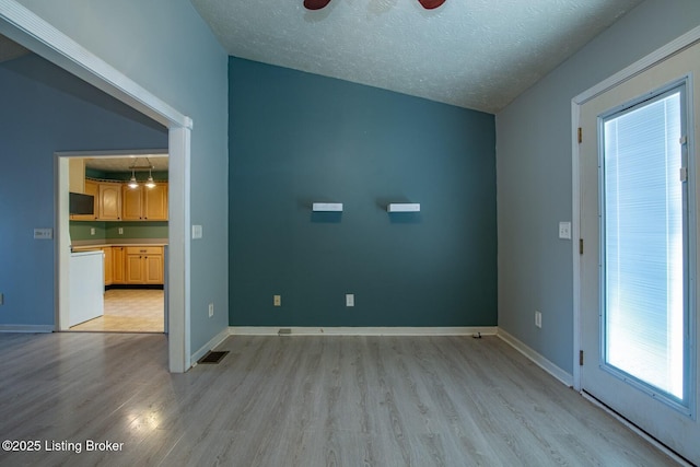 41 Raspberry Ct, Brandenburg, KY 40108 - unfurnished room with light wood-style floors and a textured ceiling