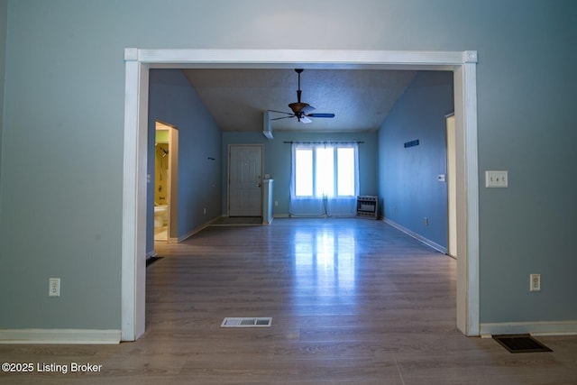 41 Raspberry Ct, Brandenburg, KY 40108 - empty room featuring vaulted ceiling, a ceiling fan, and wood finished floors
