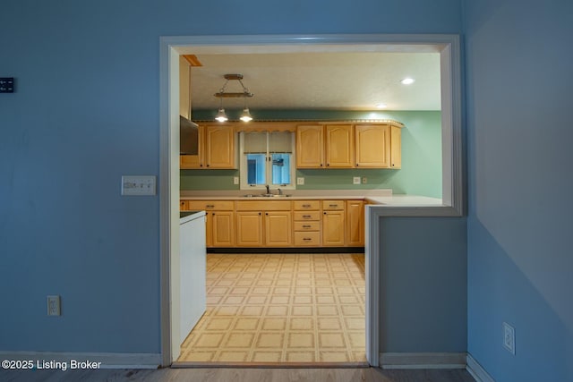 41 Raspberry Ct, Brandenburg, KY 40108 - kitchen with light brown cabinetry, light countertops, light flooring, and extractor fan