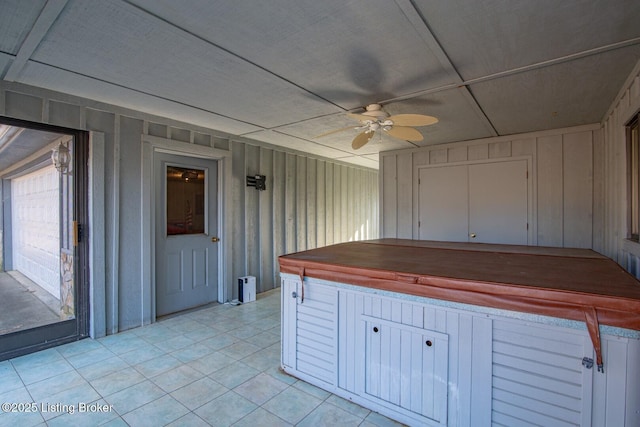 41 Raspberry Ct, Brandenburg, KY 40108 - kitchen with a ceiling fan, light tile patterned floors, and wooden walls
