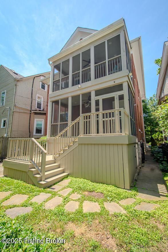 1211 Everett Ave, Louisville, KY 40204 - back of house with stairway and a sunroom