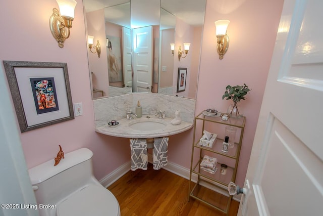 1211 Everett Ave, Louisville, KY 40204 - half bath featuring toilet and wood finished floors