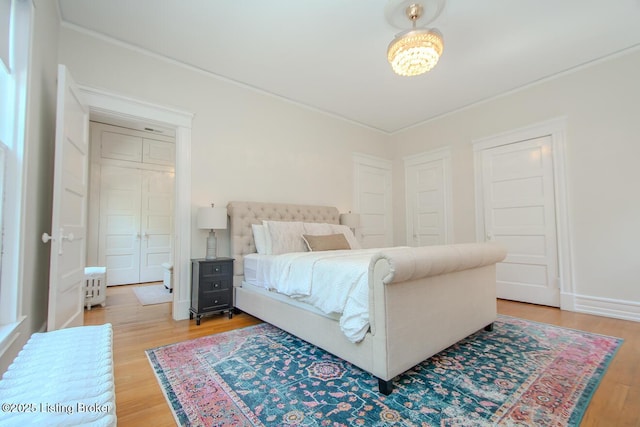 1211 Everett Ave, Louisville, KY 40204 - bedroom with wood finished floors and ornamental molding