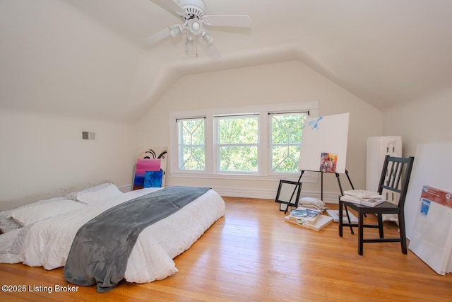 1211 Everett Ave, Louisville, KY 40204 - bedroom featuring light wood-style flooring, vaulted ceiling, and freestanding refrigerator