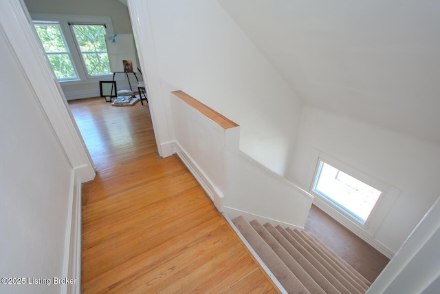 1211 Everett Ave, Louisville, KY 40204 - hallway with light wood-style floors and stairway