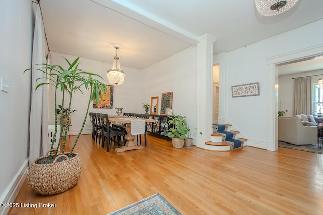 1211 Everett Ave, Louisville, KY 40204 - dining space featuring wood finished floors and a chandelier