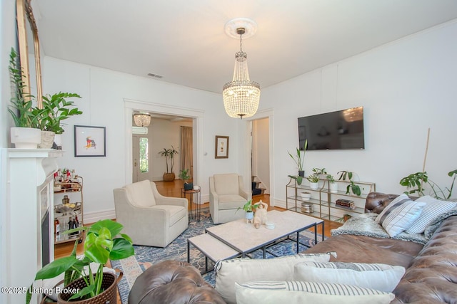 1211 Everett Ave, Louisville, KY 40204 - living room featuring wood finished floors and a chandelier
