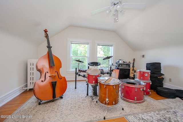 1211 Everett Ave, Louisville, KY 40204 - playroom with wood finished floors, radiator heating unit, lofted ceiling, and a ceiling fan