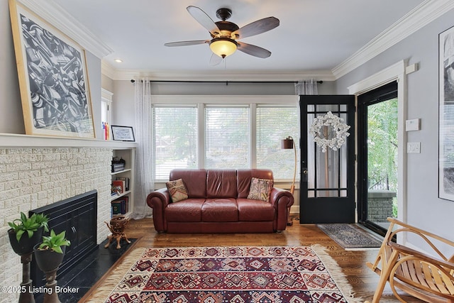1700 Shady Ln, Louisville, KY 40205 - living room with plenty of natural light, wood finished floors, crown molding, a ceiling fan, and a brick fireplace