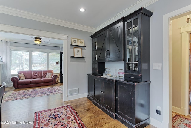 1700 Shady Ln, Louisville, KY 40205 - bar area featuring wood finished floors, ornamental molding, recessed lighting, and a ceiling fan