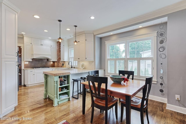 1700 Shady Ln, Louisville, KY 40205 - dining area featuring ornamental molding, healthy amount of natural light, light wood finished floors, and recessed lighting