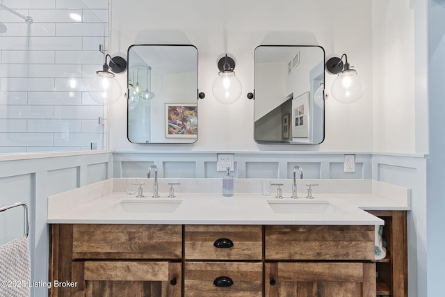 1700 Shady Ln, Louisville, KY 40205 - bathroom with a decorative wall, double vanity, and wainscoting