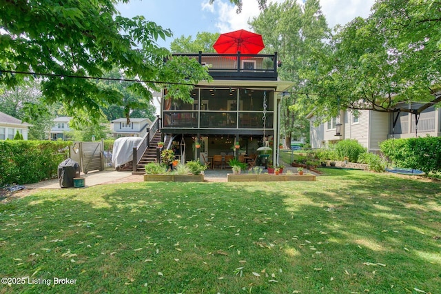 1700 Shady Ln, Louisville, KY 40205 - rear view of property featuring a patio area, stairway, a lawn, a sunroom, and outdoor dining area