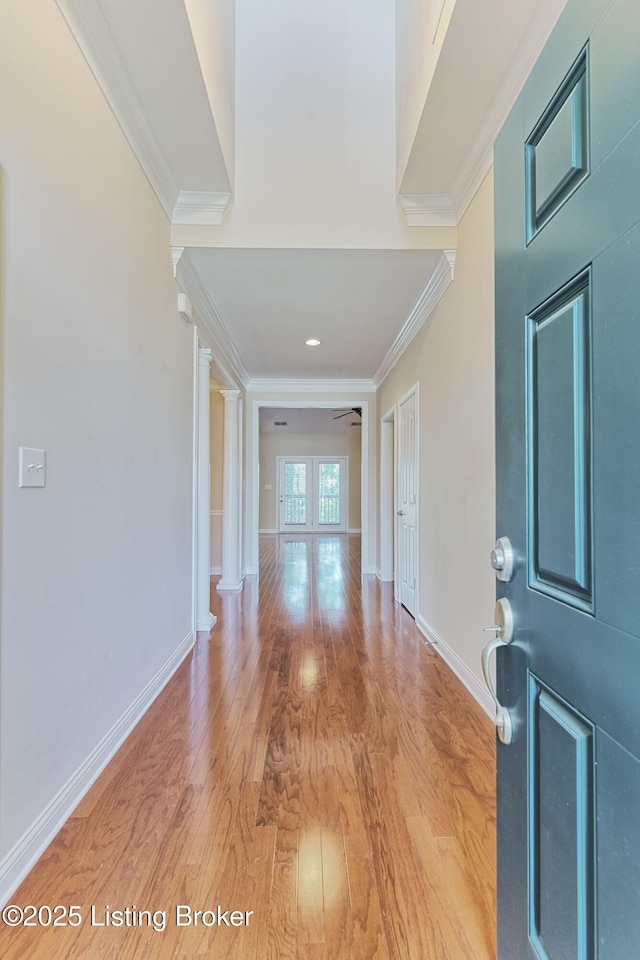 14518 Lake Village Dr Unit 4B, Louisville, KY 40299 - entryway featuring ornamental molding, light wood-type flooring, decorative columns, and ceiling fan