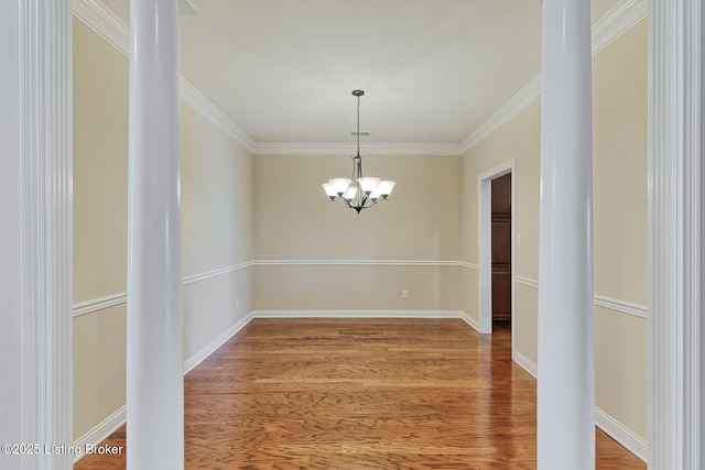 14518 Lake Village Dr Unit 4B, Louisville, KY 40299 - spare room with a chandelier, ornamental molding, and wood finished floors