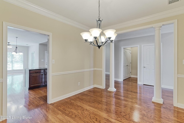 14518 Lake Village Dr Unit 4B, Louisville, KY 40299 - unfurnished dining area with a chandelier, wood finished floors, and crown molding