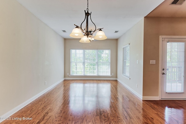 14518 Lake Village Dr Unit 4B, Louisville, KY 40299 - empty room featuring wood finished floors and a chandelier