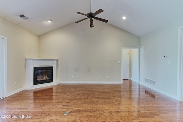14518 Lake Village Dr Unit 4B, Louisville, KY 40299 - unfurnished living room featuring high vaulted ceiling, ceiling fan, wood finished floors, a glass covered fireplace, and recessed lighting